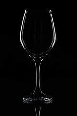 Wine glass on the black background. White contour on the black. 