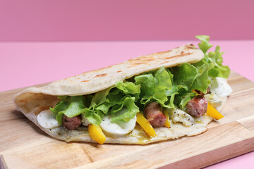 Italian cuisine , Piadina with sausage and cheese
