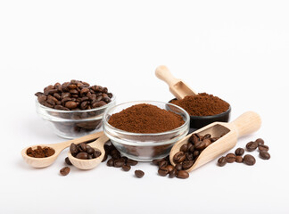 Bowl of ground coffee and beans isolated on a white background.