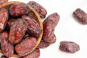 close up of pile of dates isolated on white background. High angle view