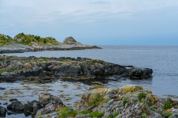 Beautiful view of rock formations at the coastline in Refviksanden Beach