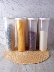 Organization of food storage in the kitchen, transparent reusable jars for cereals, coffee, sugar and pasta