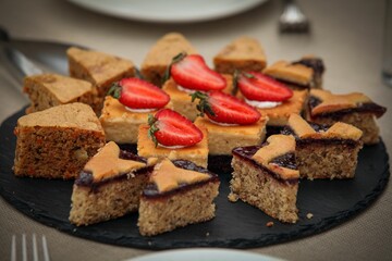 Closeup shot of sweet cakes with fresh strawberries