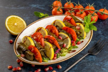 Closeup shot of Yalanji dish made of grape leaves and different vegetables with rice