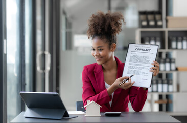 Female real estate agent offering to sell a house or condo Commercial building and house and land...