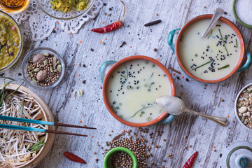 Fototapeta na wymiar Soup, chopsticks and spices on a kitchen table