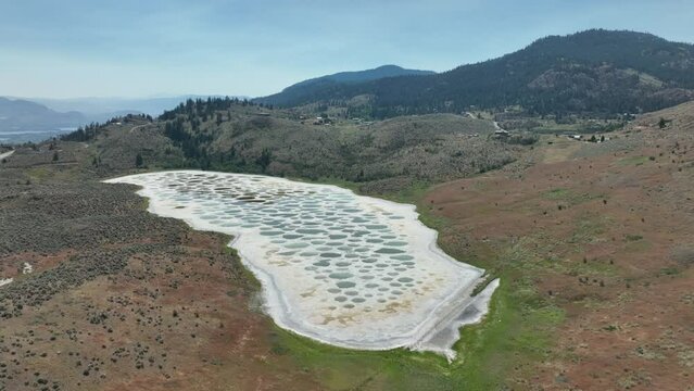 View of Spotted Lake, saline, alkaline lake located in Osoyoos in valley in British Columbia, Canada