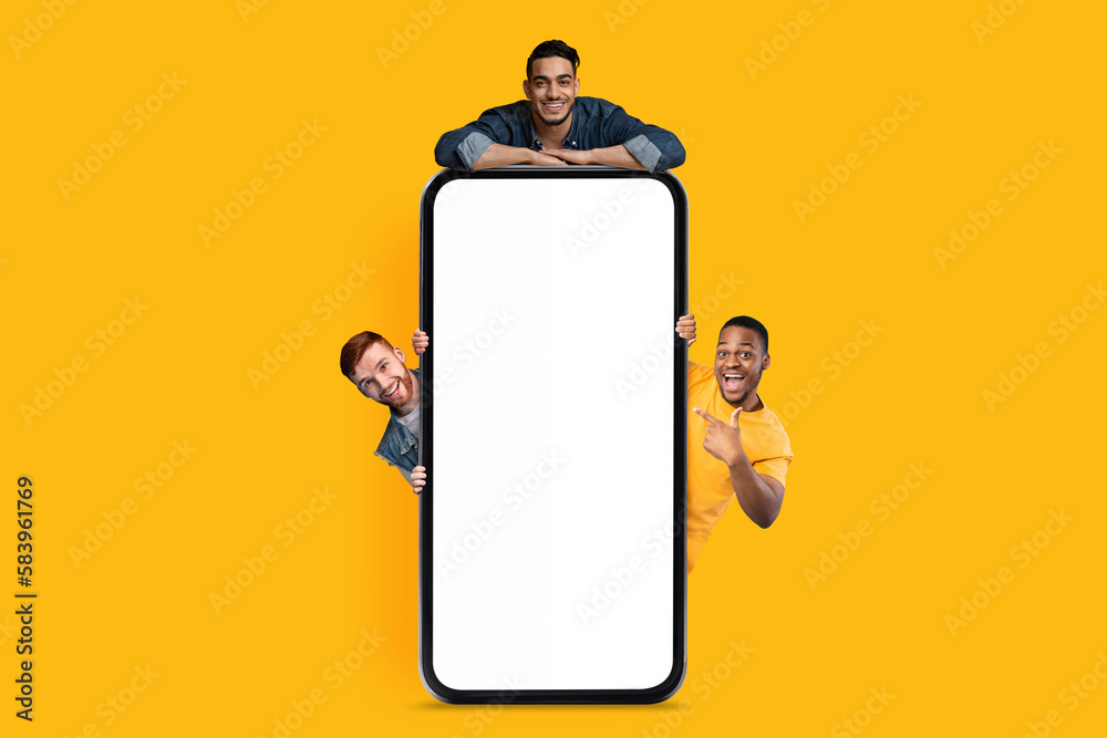 Poster great ad. three happy men posing near blank smartphone with white screen