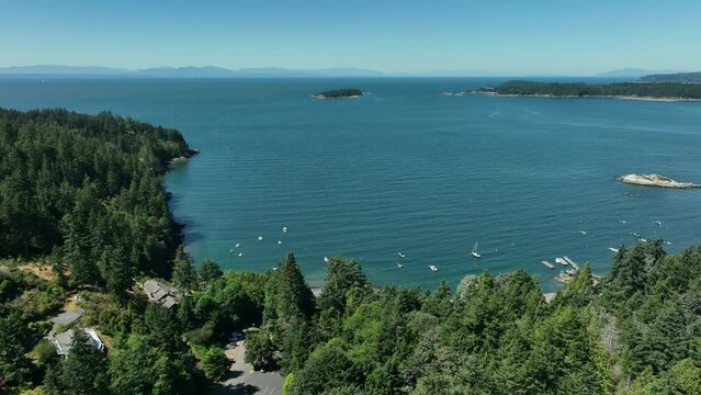 Snug Cove, Bowen Island, British Columbia, Canada. Aerial view of marina, pier, beach and resorts