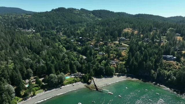 Snug Cove, Bowen Island, British Columbia, Canada. Aerial view of marina, pier, beach and resorts