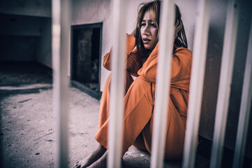Portrait of women desperate to catch the iron prison,prisoner concept,thailand people,Hope to be...