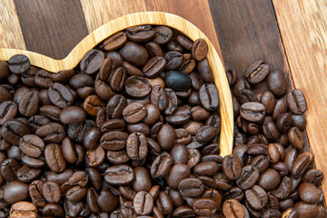 coffee beans in heart-shaped tra,y representing love of coffee