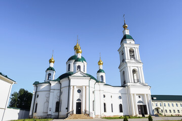 Fototapeta na wymiar orthodox white church on the territory of the monastery, sunny summer day