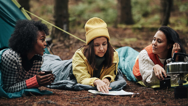 Diverse friends relaxing at their campsite