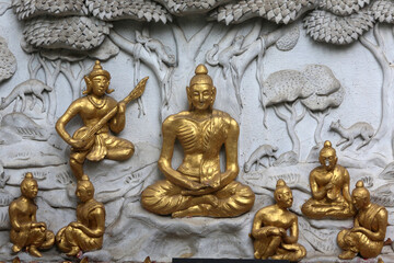 Relief depicting a scene of the Buddha's life in Wat Chai Mongkhon, Chiang Mai. Buddha as an ascetic. Thailand..