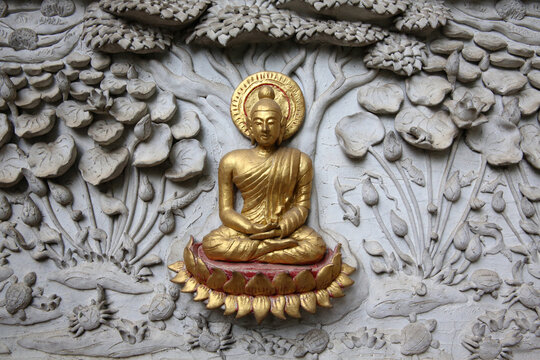 Relief depicting a scene of the Buddha's life in Wat Chai Mongkhon, Chiang Mai. Meditating Buddha. Thailand