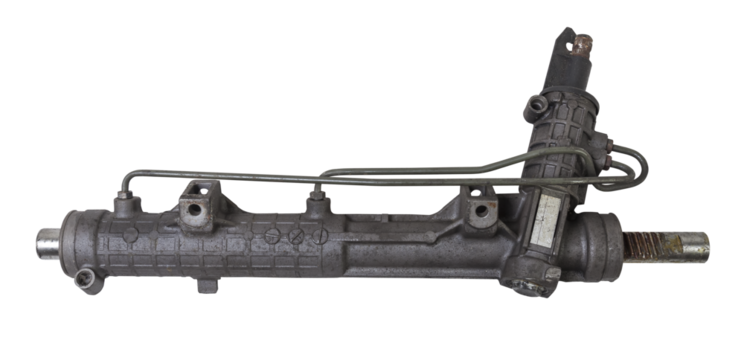 Spare part of the car steering rack new in plastic packaging for turning the wheels close-up on the floor of the tile to perform vehicle maintenance in auto service.