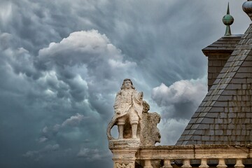 Statue of the tower of the Town Hall of Astorga with a cloudy sky.