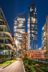 New York City Highline promenade with Hudson Yards skyscrapers at night. Evening in Manhattan