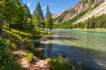 Fototapeta na wymiar Orceyrette Lake in Summer in the French Alps. Briancon Region. Hautes-Alpes. France