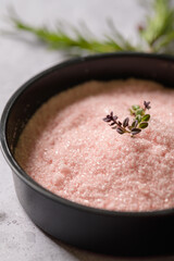 Close-up view of a bowl with pink salt