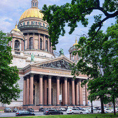 view from the square to the magnificent St. Isaac's Cathedral against the background of a blue cloudy sky - 583982174