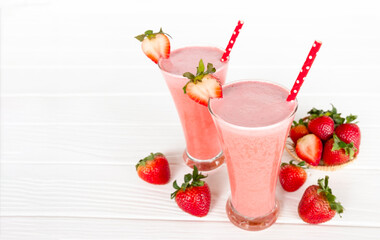 Strawberry yogurt fruit juice smoothie pink colorful fruit juice milkshake blend beverage healthy high protein the taste yummy In glass drink episode morning on white wood background.
