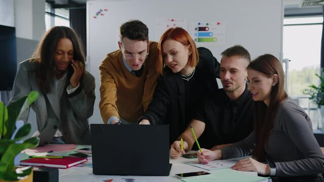 Five people are discussing a new project in the office. Creating a new business. Multinational company