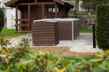 Community composter placed in a common residential area to recycle and reduce the organic waste produced in apartments. Concept of recycling and sustainability