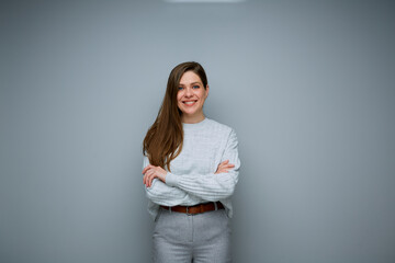 Smiling business woman with crossed arms isolated portrait.