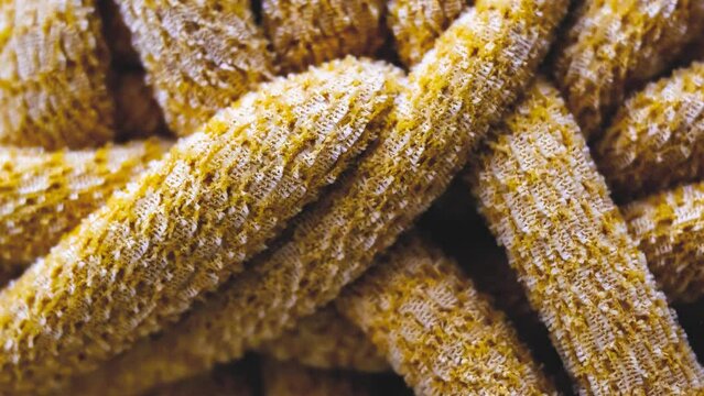 A close-up of a thick round knitting yarn.  This yarn is very thick and round and is not the easiest one to knit with. Zoom in tight shot of Yarn.