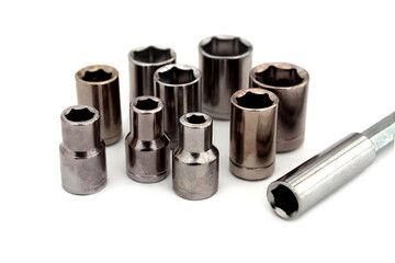 Screwdriver with bits for tightening bolts lie on a white background.	