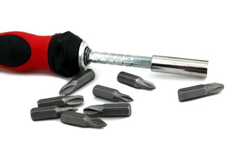 A screwdriver with a removable tip lies on a white isolated background.	