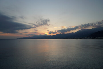 Sunrise behind the mountains over the Aegean Sea. October morning. The magic of nature	