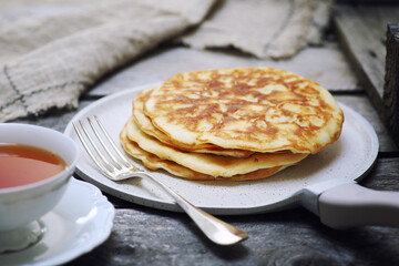 French cuisine. Matefaim. Sweet Apple Pancakes and cup of tea