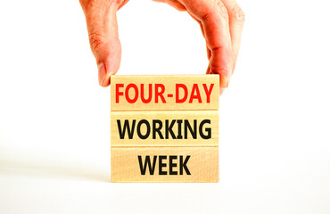 Four-day working week symbol. Concept words Four-day working week on wooden block on a beautiful white table white background. Businessman hand. Business four-day working week concept. Copy space.