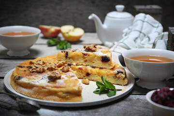 French cuisine. Matefaim. Sweet Apple Pancake with dried cranberries and walnuts for breakfast
