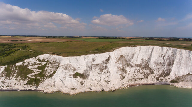 Aerial view of white cliffs of Dover, English Channel on a sunny summer day .