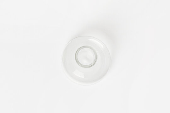Empty conical laboratory flask on a light background. View from above.