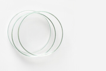 Three empty Petri dishes on a light background.