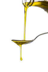 Olive oil flowing to the spoon on the white background