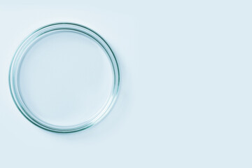 Empty petri dish made of blue glass. On a blue background.