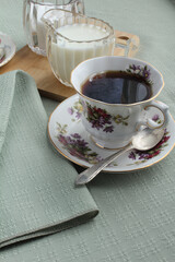 Coffee break in a fancy china cup and saucer.
