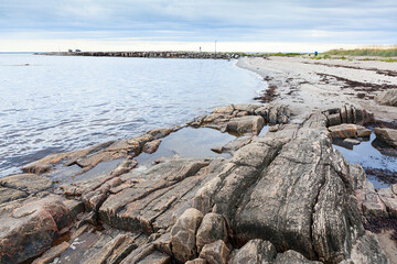 Sandy coast of the White Sea interspersed with rocks. The Belomorsky district, Republic of Karelia, Russia