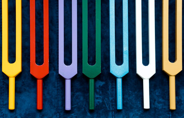 Set of colorful metal tuning forks - tools sound healing