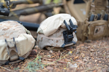 Gun weapons bags and helmets for Army marine corps soldier military war participating and preparing to attack the enemy in Thailand during Exercise Cobra Gold in battle. Combat force training.