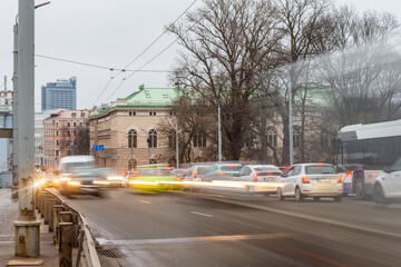 Traffic cars in motion during rush hour entering and exiting the city of Riga, Latvia