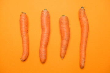 Fresh Carrots isolated on orange background