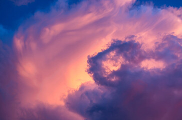 abstract background of a storm cloud colored by the sun