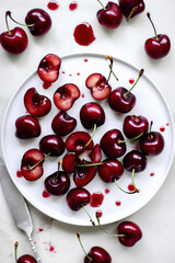 cherries on a white plate 